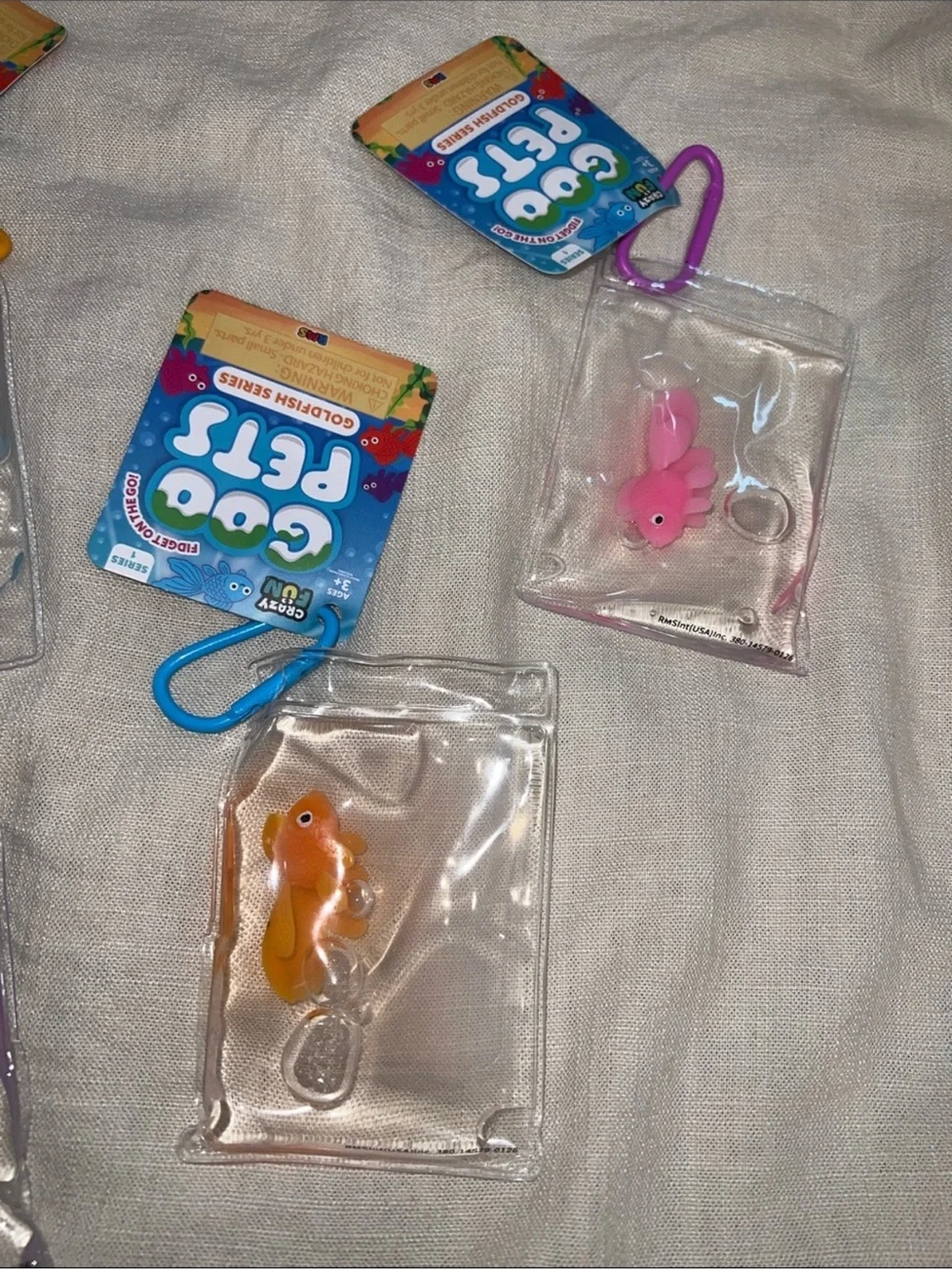 Goo Pets Squishy Goldfish Keychain Pack — Blue, Pink, Orange, Purple